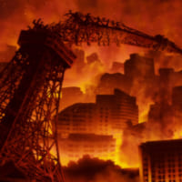東京タワーのような塔が折れ曲がり炎に包まれる街